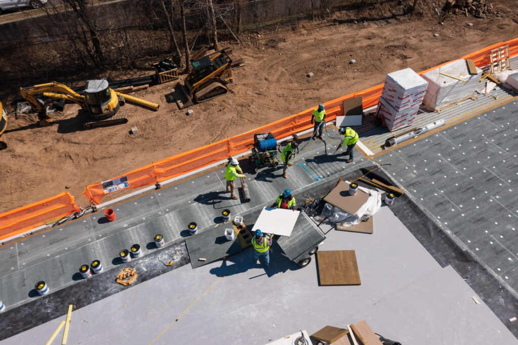 DensDeck Roof Board being installed on a flat roof